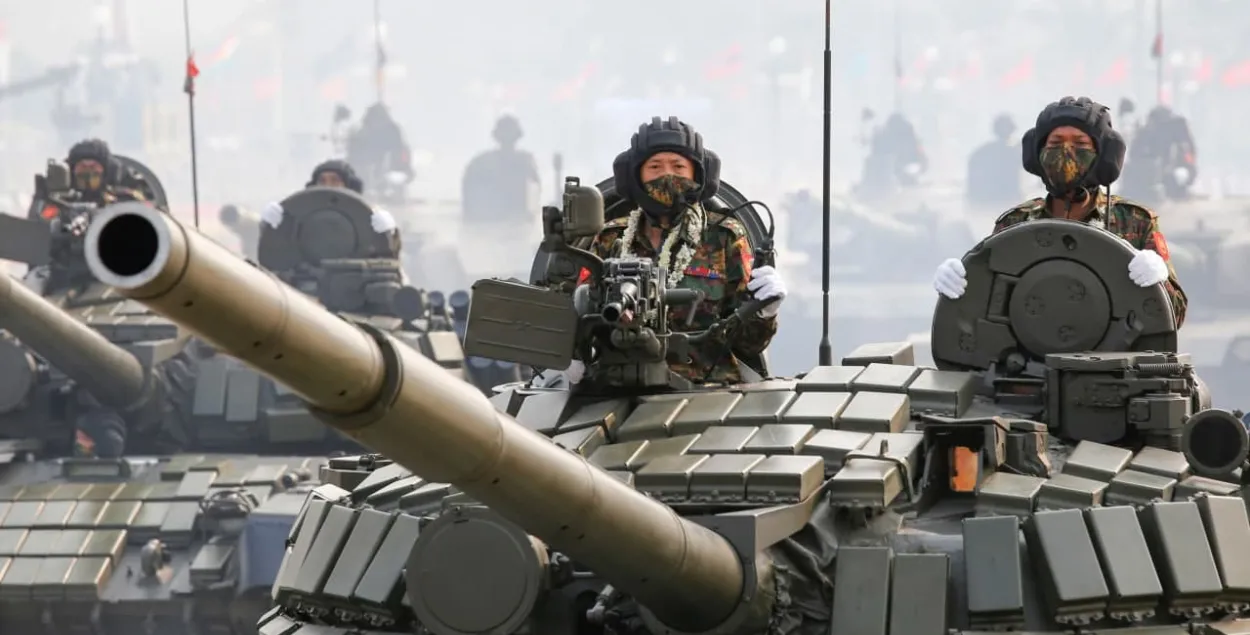 Soldiers on tanks taking part&nbsp;in Armed Forces Day parade in Myanmar / Reuters